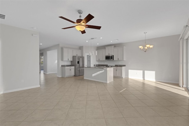 6211 114th Dr E, Parrish, FL 34219 - kitchen featuring appliances with stainless steel finishes, open floor plan, a chandelier, and recessed lighting