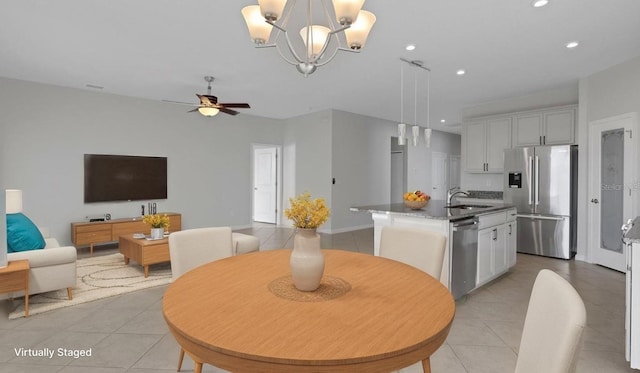 6211 114th Dr E, Parrish, FL 34219 - dining space with light tile patterned flooring, recessed lighting, a ceiling fan, and a chandelier