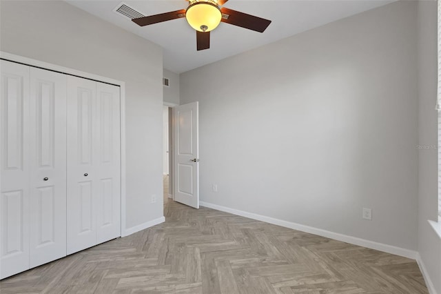 6211 114th Dr E, Parrish, FL 34219 - unfurnished bedroom with a closet, baseboards, and ceiling fan