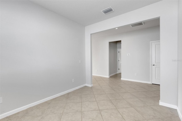 6211 114th Dr E, Parrish, FL 34219 - spare room with baseboards and light tile patterned floors