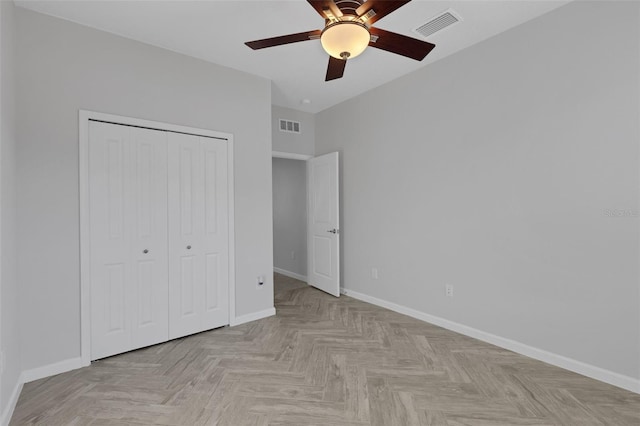 6211 114th Dr E, Parrish, FL 34219 - unfurnished bedroom featuring baseboards, a closet, and a ceiling fan