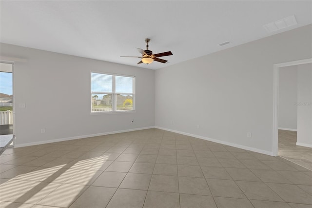6211 114th Dr E, Parrish, FL 34219 - spare room featuring light tile patterned floors, ceiling fan, and baseboards