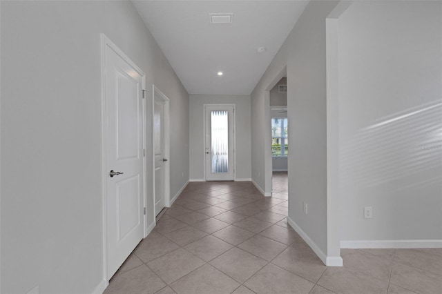 6211 114th Dr E, Parrish, FL 34219 - foyer with light tile patterned floors and baseboards