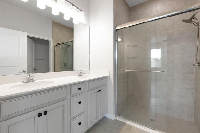 6211 114th Dr E, Parrish, FL 34219 - bathroom with a stall shower, double vanity, and tile patterned floors