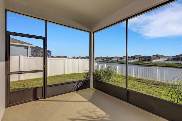 6211 114th Dr E, Parrish, FL 34219 - unfurnished sunroom with a water view, a residential view, and healthy amount of natural light