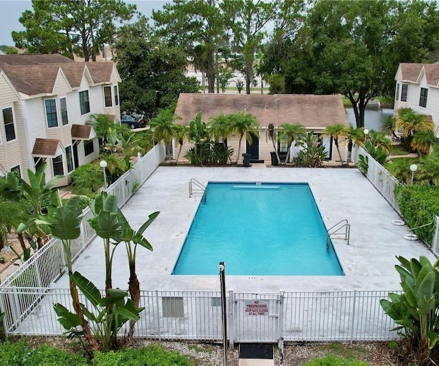 2302 Maki Rd Unit 69, Plant City, FL 33563 - community pool featuring a fenced backyard and a patio