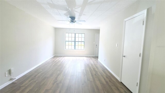 2302 Maki Rd Unit 69, Plant City, FL 33563 - spare room featuring ceiling fan, wood finished floors, baseboards, and a textured ceiling