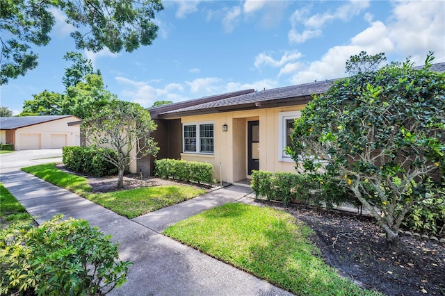 860 Maclaren Dr N Unit A, Palm Harbor, FL 34684 - ranch-style house with a garage