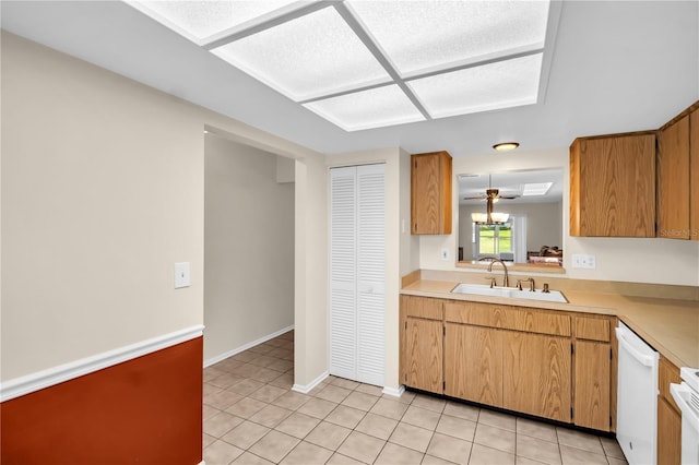 860 Maclaren Dr N Unit A, Palm Harbor, FL 34684 - kitchen with a sink, dishwasher, light countertops, and light tile patterned floors