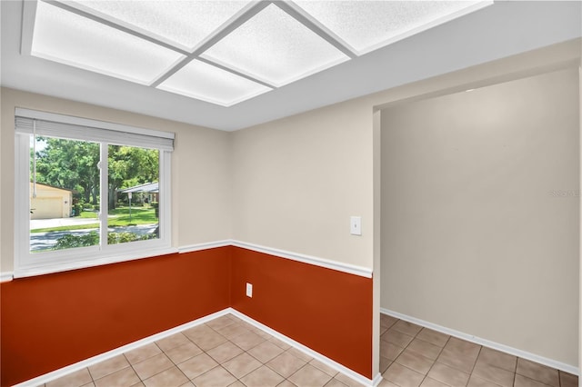 860 Maclaren Dr N Unit A, Palm Harbor, FL 34684 - unfurnished room featuring light tile patterned floors and baseboards