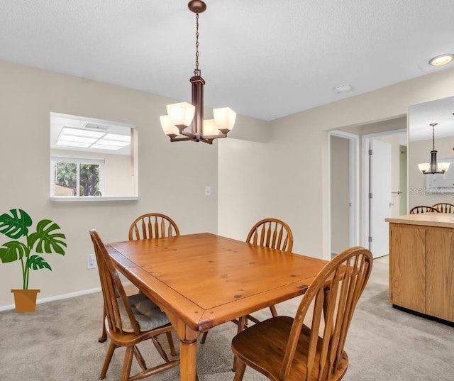 860 Maclaren Dr N Unit A, Palm Harbor, FL 34684 - dining room with a chandelier, light colored carpet, and baseboards