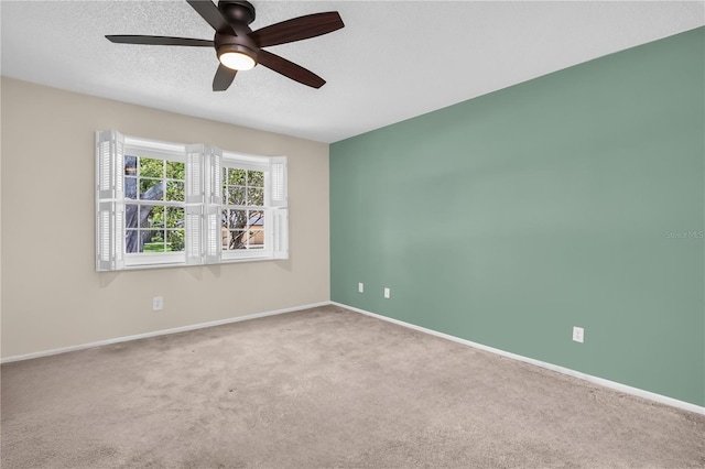 860 Maclaren Dr N Unit A, Palm Harbor, FL 34684 - spare room featuring carpet flooring, a ceiling fan, a textured ceiling, and baseboards