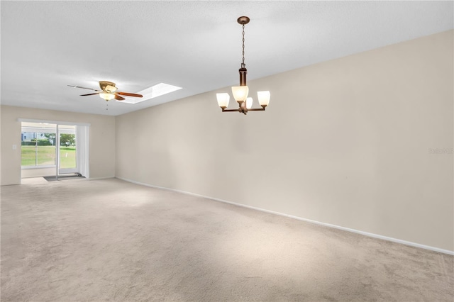 860 Maclaren Dr N Unit A, Palm Harbor, FL 34684 - carpeted empty room with a skylight, ceiling fan, a chandelier, and baseboards