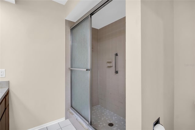 860 Maclaren Dr N Unit A, Palm Harbor, FL 34684 - full bathroom featuring vanity, a stall shower, tile patterned floors, and baseboards
