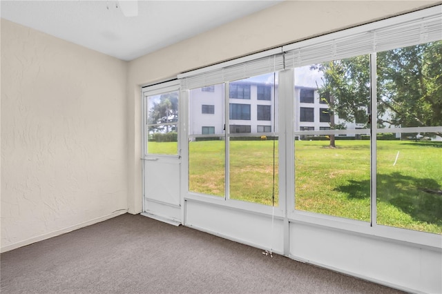 860 Maclaren Dr N Unit A, Palm Harbor, FL 34684 - unfurnished sunroom with a ceiling fan