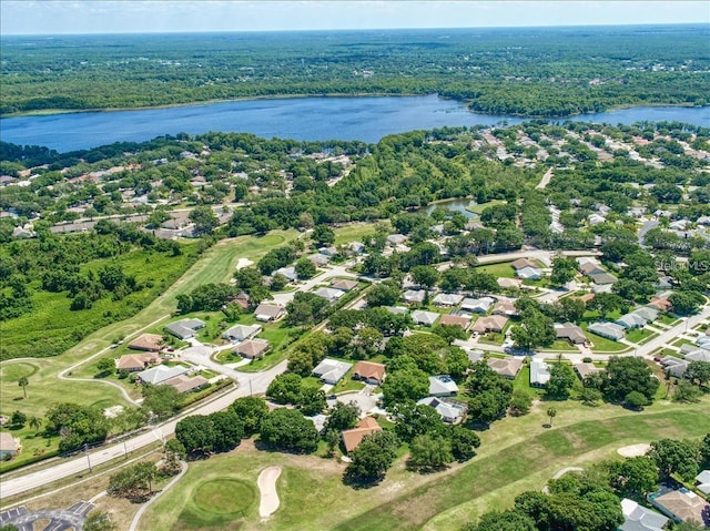 860 Maclaren Dr N Unit A, Palm Harbor, FL 34684 - aerial view of residential area featuring a nearby body of water, a golf club, and a forest
