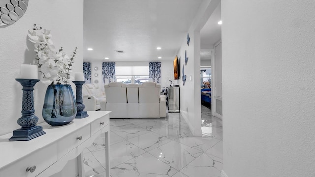 12416 Queensland Ln, Tampa, FL 33625 - corridor featuring light marble finish flooring and recessed lighting