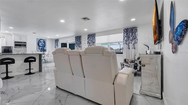 12416 Queensland Ln, Tampa, FL 33625 - living area with light marble finish flooring and recessed lighting