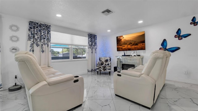12416 Queensland Ln, Tampa, FL 33625 - living room featuring light marble finish floors, baseboards, recessed lighting, and a fireplace