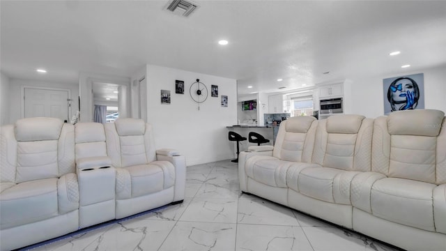 12416 Queensland Ln, Tampa, FL 33625 - living area featuring recessed lighting, light marble finish floors, baseboards, and healthy amount of natural light