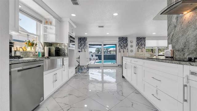 12416 Queensland Ln, Tampa, FL 33625 - kitchen with dishwasher, dark stone countertops, recessed lighting, white cabinetry, and tasteful backsplash