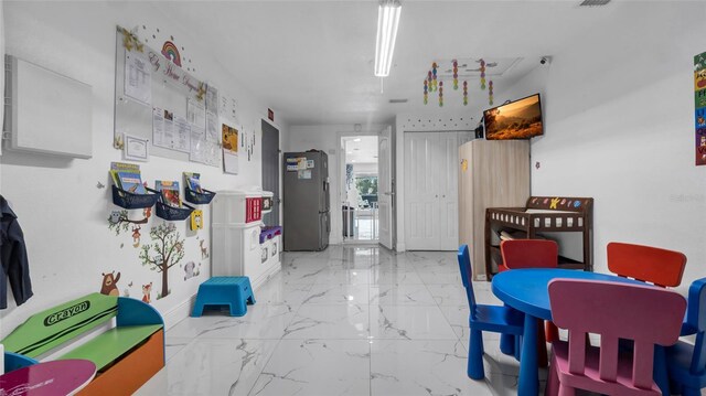 12416 Queensland Ln, Tampa, FL 33625 - kitchen featuring marble finish floors and freestanding refrigerator