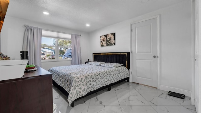 12416 Queensland Ln, Tampa, FL 33625 - bedroom with light marble finish flooring, a textured ceiling, recessed lighting, and baseboards