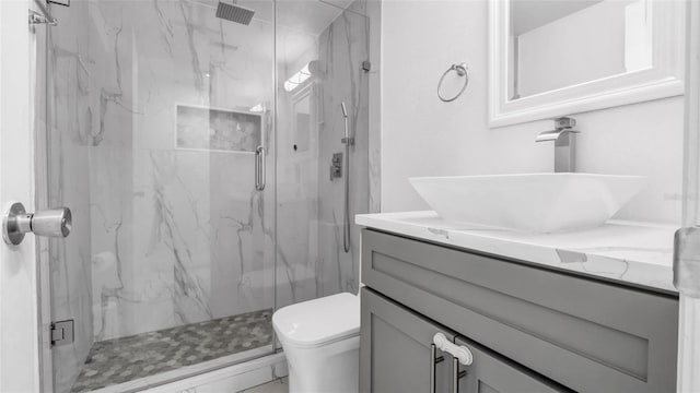 12416 Queensland Ln, Tampa, FL 33625 - bathroom with vanity, a marble finish shower, and toilet