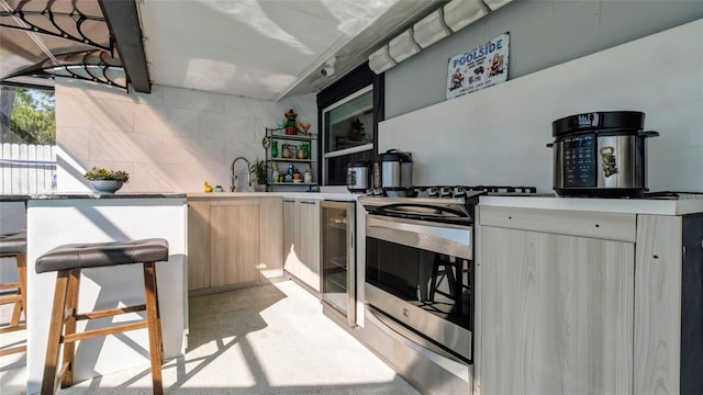 12416 Queensland Ln, Tampa, FL 33625 - kitchen featuring stainless steel range, a sink, light countertops, open shelves, and modern cabinets