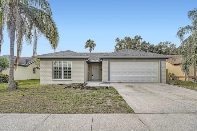 3058 Cara Ct, Palm Harbor, FL 34684 - single story home featuring an attached garage, concrete driveway, a front yard, and brick siding