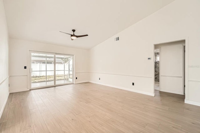 3058 Cara Ct, Palm Harbor, FL 34684 - empty room featuring ceiling fan, light wood-type flooring, baseboards, and vaulted ceiling