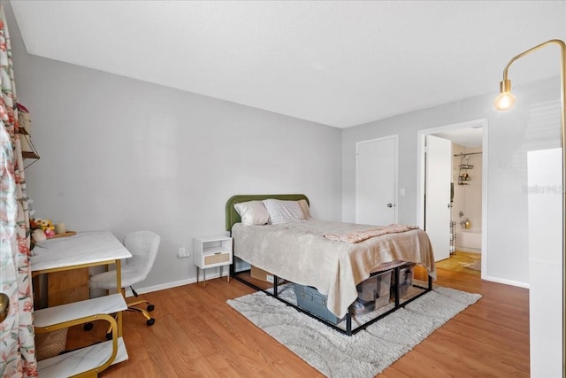 4004 Dream Oak Pl Unit 102, Tampa, FL 33613 - bedroom featuring wood finished floors and baseboards