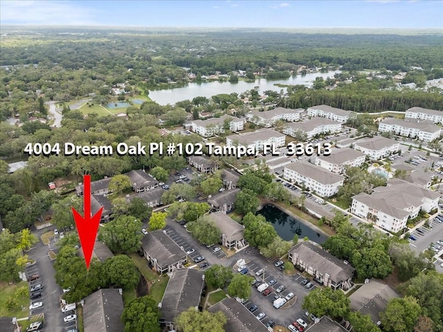 4004 Dream Oak Pl Unit 102, Tampa, FL 33613 - aerial view of property's location with a large body of water and a heavily wooded area
