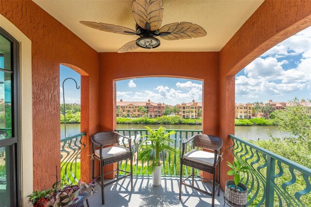 2741 Via Cipriani Unit 934B, Clearwater, FL 33764 - balcony with a water view, a ceiling fan, and a residential view