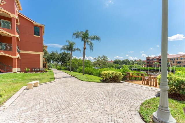 2741 Via Cipriani Unit 934B, Clearwater, FL 33764 - view of community with a lawn