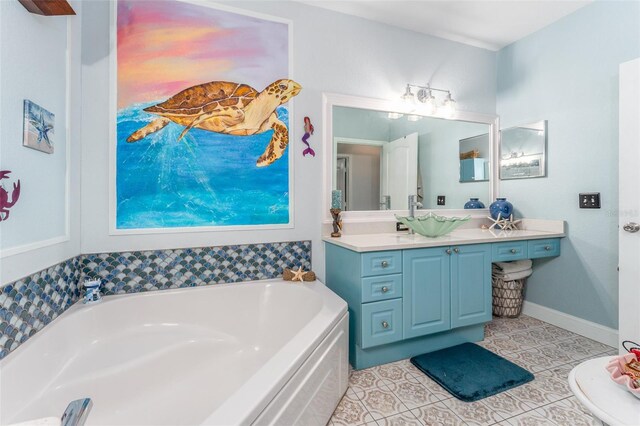 2741 Via Cipriani Unit 934B, Clearwater, FL 33764 - bathroom with a garden tub, vanity, and tile patterned floors