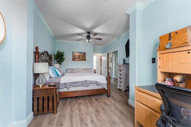 2741 Via Cipriani Unit 934B, Clearwater, FL 33764 - bedroom featuring ornamental molding, light wood finished floors, baseboards, an office area, and ceiling fan
