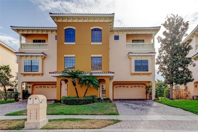 1531 Ember Ln, Tarpon Springs, FL 34689 - mediterranean / spanish house with an attached garage, stucco siding, decorative driveway, and a tile roof