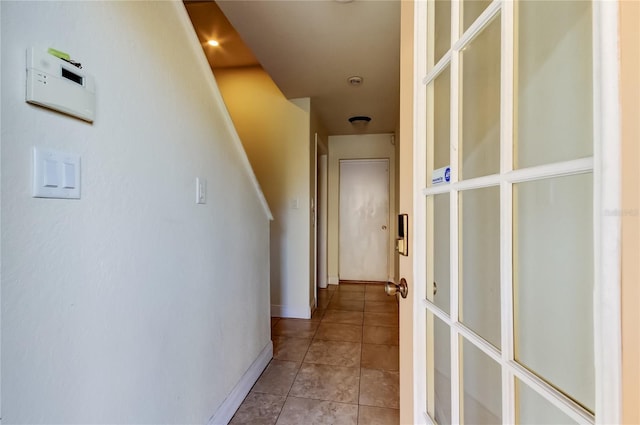 1531 Ember Ln, Tarpon Springs, FL 34689 - corridor with light tile patterned floors and baseboards
