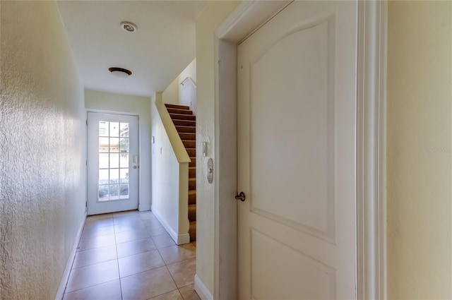 1531 Ember Ln, Tarpon Springs, FL 34689 - entryway featuring stairway, baseboards, and light tile patterned floors
