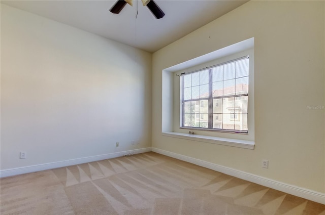 1531 Ember Ln, Tarpon Springs, FL 34689 - empty room featuring light colored carpet, baseboards, and ceiling fan