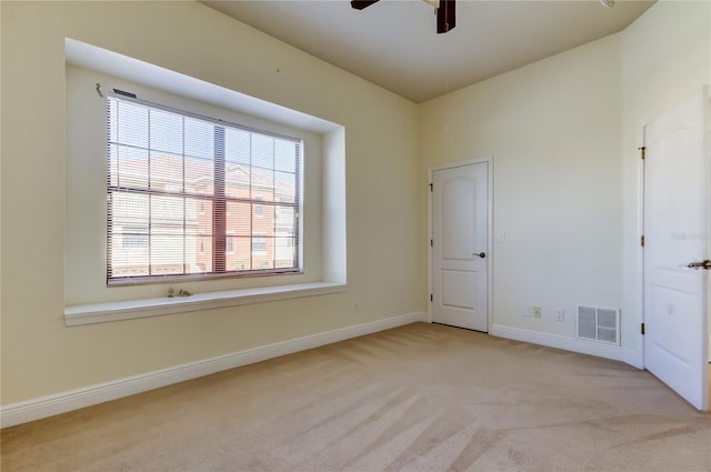 1531 Ember Ln, Tarpon Springs, FL 34689 - unfurnished room with carpet flooring, a ceiling fan, and baseboards