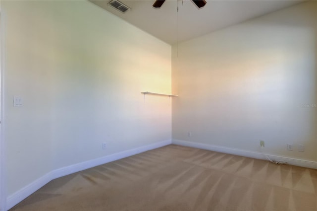 1531 Ember Ln, Tarpon Springs, FL 34689 - empty room featuring light carpet, ceiling fan, baseboards, and vaulted ceiling