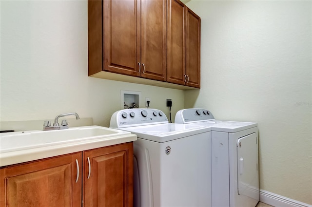 1531 Ember Ln, Tarpon Springs, FL 34689 - laundry room with cabinet space and washer and clothes dryer