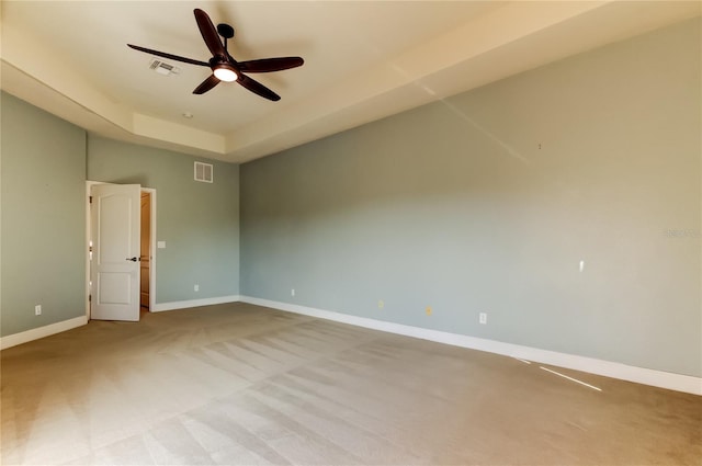 1531 Ember Ln, Tarpon Springs, FL 34689 - carpeted spare room featuring a ceiling fan, baseboards, and a raised ceiling