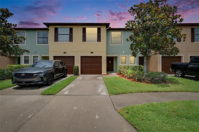 2435 Edgewater Falls Dr, Brandon, FL 33511 - multi unit property with stucco siding, driveway, and a garage
