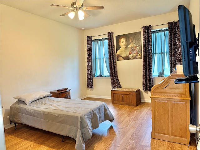 2130 Broadway View Ave, Brandon, FL 33510 - bedroom featuring light wood-style floors, baseboards, and a ceiling fan