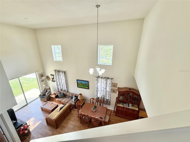2130 Broadway View Ave, Brandon, FL 33510 - living area with a high ceiling, a chandelier, and wood finished floors