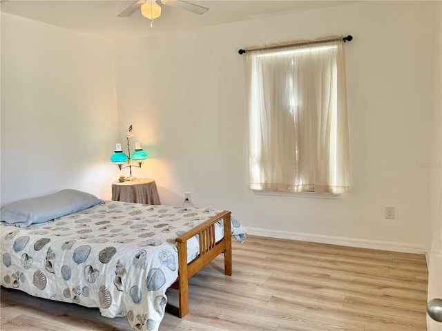 2130 Broadway View Ave, Brandon, FL 33510 - bedroom with wood finished floors, baseboards, and a ceiling fan