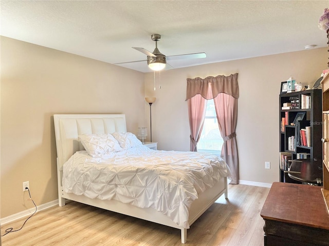 2130 Broadway View Ave, Brandon, FL 33510 - bedroom with light wood-style flooring, baseboards, and a ceiling fan